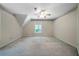 This bedroom has neutral paint with a ceiling fan and natural light at 5960 Camelia Dr, Douglasville, GA 30135