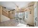 Bright dining area with tiled floor, bay window and seating, and stairway access at 5960 Camelia Dr, Douglasville, GA 30135