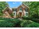 Beautiful brick home with manicured landscaping and a charming entrance nestled in a lush, green setting at 5960 Camelia Dr, Douglasville, GA 30135