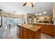 Bright kitchen with a center island, tile floors, and an adjacent dining area with bay window at 5960 Camelia Dr, Douglasville, GA 30135