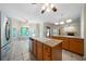 Open concept kitchen with views to breakfast nook and living room with fireplace at 5960 Camelia Dr, Douglasville, GA 30135