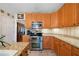 Kitchen featuring stainless steel appliances, granite countertops, and views into the dining area at 5960 Camelia Dr, Douglasville, GA 30135