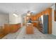 Open kitchen with stainless steel appliances, granite countertops and tile floors at 5960 Camelia Dr, Douglasville, GA 30135