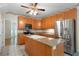 Well-equipped kitchen boasts stainless steel appliances and center island with granite countertops at 5960 Camelia Dr, Douglasville, GA 30135