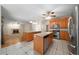 Open concept kitchen with views to breakfast nook and living room with fireplace at 5960 Camelia Dr, Douglasville, GA 30135