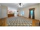 Inviting living room with hardwood floors, a fireplace, and a doorway leading to a kitchen area at 5960 Camelia Dr, Douglasville, GA 30135