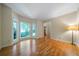 Sunlit living room with hardwood floors, a large bay window, and neutral paint at 5960 Camelia Dr, Douglasville, GA 30135