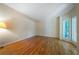 Open living room with hardwood floors, large windows, and neutral paint at 5960 Camelia Dr, Douglasville, GA 30135