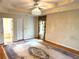 Main bedroom featuring carpet, ceiling fan, and decorative curtains at 5960 Camelia Dr, Douglasville, GA 30135