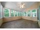 Bright sunroom features multiple windows that bring the outdoors in at 5960 Camelia Dr, Douglasville, GA 30135