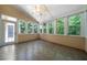 Bright sunroom features multiple windows that bring the outdoors in at 5960 Camelia Dr, Douglasville, GA 30135