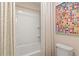 Bathroom featuring a tub, shower, and a modern art print at 133 Frontier Way, Mcdonough, GA 30253