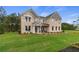 Attractive two-story brick home with well-kept lawn, manicured landscaping, and a welcoming entryway at 133 Frontier Way, Mcdonough, GA 30253