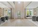 Spacious foyer with hardwood floors, soaring ceilings, and seamless transition to dining and living spaces at 133 Frontier Way, Mcdonough, GA 30253