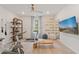Bright home gym featuring modern exercise equipment, motivational wall art and a calming beach scene on the television at 133 Frontier Way, Mcdonough, GA 30253