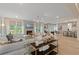 Spacious and bright open-concept living room with a fireplace, plush seating, and modern décor with backyard view at 133 Frontier Way, Mcdonough, GA 30253