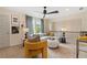 Loft area with seating, a ceiling fan, and natural light, perfect for relaxing or entertaining guests at 133 Frontier Way, Mcdonough, GA 30253