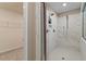 A tiled walk-in shower with dual shower heads and a glass enclosure at 133 Frontier Way, Mcdonough, GA 30253