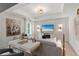 A well-lit, cozy sitting area features wainscoting, recessed lighting, and modern decor at 133 Frontier Way, Mcdonough, GA 30253