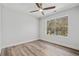Bright bedroom has modern flooring, fresh paint, and a large window at 2111 Glenwood Downs Dr, Decatur, GA 30035
