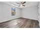 Spacious bedroom has a ceiling fan and a window with a view at 2111 Glenwood Downs Dr, Decatur, GA 30035