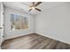 Bright bedroom has modern flooring, a ceiling fan, and a large window at 2111 Glenwood Downs Dr, Decatur, GA 30035