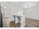 Open-concept dining area featuring hardwood floors, view of the kitchen, and connecting living spaces at 2111 Glenwood Downs Dr, Decatur, GA 30035