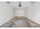 Spacious garage with concrete floors, ample lighting, and plenty of storage space at 2111 Glenwood Downs Dr, Decatur, GA 30035