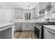 Well-equipped kitchen with stainless steel appliances, white quartz countertops and subway tile backsplash at 2111 Glenwood Downs Dr, Decatur, GA 30035