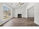 Bright living room featuring hardwood floors, fireplace, large window and plenty of natural light at 2111 Glenwood Downs Dr, Decatur, GA 30035