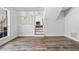 Open-concept living room with hardwood floors and a cozy fireplace feature at 2111 Glenwood Downs Dr, Decatur, GA 30035