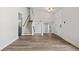 Bright living room featuring hardwood floors, staircase, and a white front door at 2111 Glenwood Downs Dr, Decatur, GA 30035