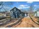 Rear view of the home featuring an outdoor space, new paint, and landscaping at 2111 Glenwood Downs Dr, Decatur, GA 30035