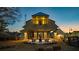 Evening view showcasing the beautiful exterior with outdoor lighting and a cozy patio area at 51 Hydrangea Unit 74 Way, Auburn, GA 30011