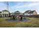 Outdoor fire pit area with seating in a community lawn setting at 51 Hydrangea Unit 74 Way, Auburn, GA 30011