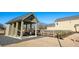 Covered outdoor structure with picnic table and adjacent fenced area next to the home at 51 Hydrangea Unit 74 Way, Auburn, GA 30011