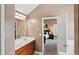 Bathroom features a double vanity with granite countertop and leads to the bedroom at 106 Dustin Dr, Stockbridge, GA 30281