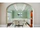 Elegant dining room featuring coffered ceiling, chandelier, and seating for six at 106 Dustin Dr, Stockbridge, GA 30281