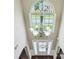 Soaring foyer showcasing a large window and a stylish chandelier with glass bulbs at 106 Dustin Dr, Stockbridge, GA 30281