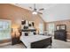 Spacious main bedroom with a vaulted ceiling, ceiling fan, and two large windows that provide lots of natural light at 106 Dustin Dr, Stockbridge, GA 30281