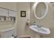 Powder room featuring a pedestal sink, wood-look floors, and neutral wall color at 113 Brianna Way, Woodstock, GA 30188