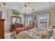 Comfortable bedroom with vaulted ceilings, a ceiling fan and large dresser at 113 Brianna Way, Woodstock, GA 30188