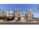 Charming townhome exteriors showcase brick accents, individual garages, and inviting entrances at 113 Brianna Way, Woodstock, GA 30188