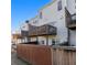 View of the rear of a townhome showing multiple decks and fenced in yards at 113 Brianna Way, Woodstock, GA 30188