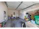 Attached garage with ample storage space and a variety of household items at 113 Brianna Way, Woodstock, GA 30188