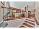 Open-concept staircase leading to a kitchen and dining area at 113 Brianna Way, Woodstock, GA 30188