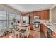 Well-lit kitchen with stainless steel appliances, wooden cabinets, and a central island at 113 Brianna Way, Woodstock, GA 30188