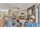 Inviting living room featuring a fireplace and an open floor plan to the dining area and kitchen at 113 Brianna Way, Woodstock, GA 30188