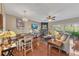 Bright living room with hardwood floors, fireplace, and dining room views at 113 Brianna Way, Woodstock, GA 30188