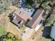 Aerial view of home with a spacious backyard deck and private driveway at 150 Forest Ridge Ct, Lawrenceville, GA 30046